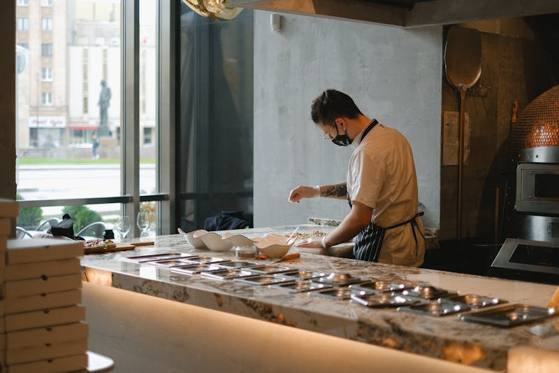 Pizza chef crafting dough by hand in the kitchen
